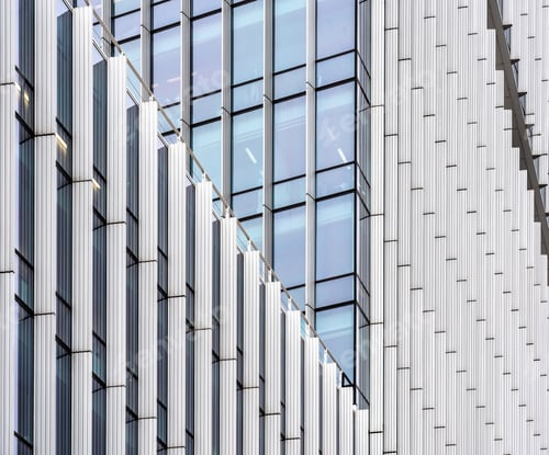 Preview: Modern skyscraper with many windows during daytime