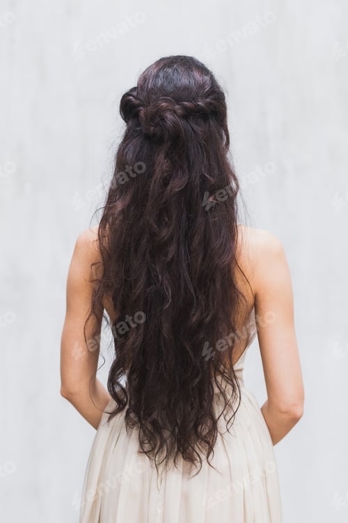 Preview: Girl with long black hair in a gentle silk wedding dress