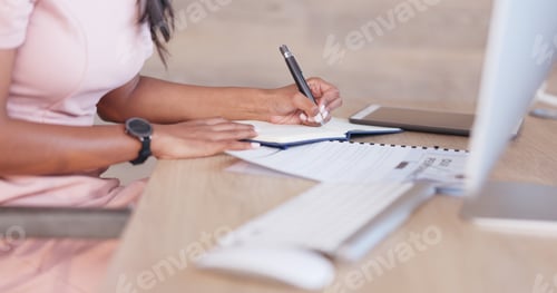 Preview: Office woman working on a schedule or online appointments and making notes in her calendar diary. O