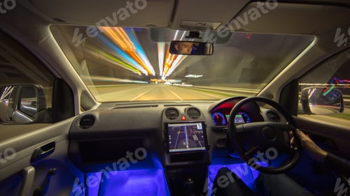 Preview: The man drive vehicle in the city road. Left side traffic. Evening night time