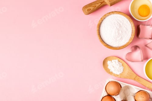 Preview: Ingredients and utensils for baking on a pastel background.
