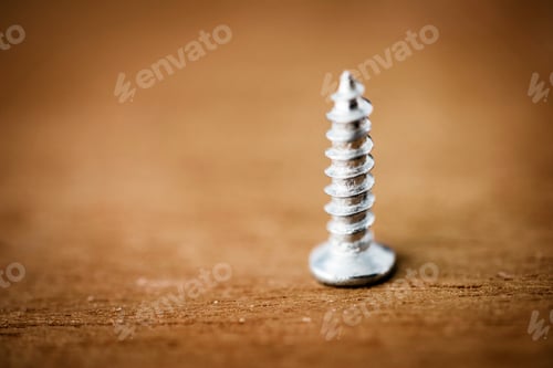 Preview: Macro shot of screw on wooden background
