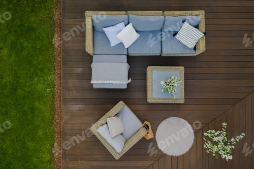 Preview: Top view of wooden terrace with comfortable wicker garden furniture