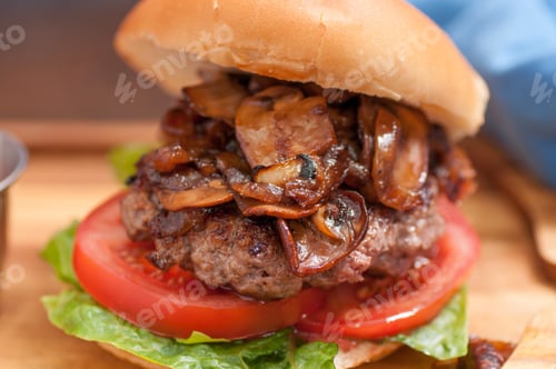 Preview: beef burger with mushrooms and onions and french fries