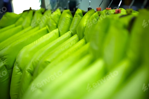 Preview: Sport and casual clothes on hangers in the shop
