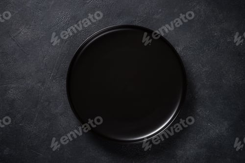 Preview: Black plate on black stone table top view