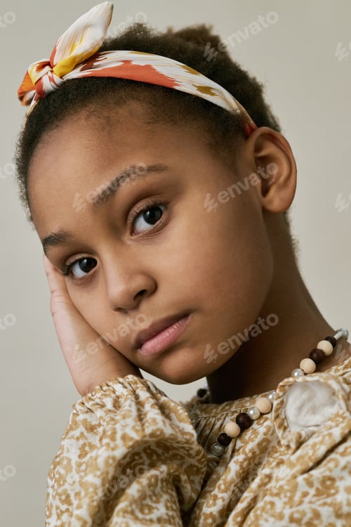 Preview: Portrait of Young Girl Resting Head on Hand