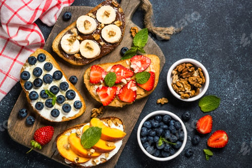 Preview: Sweet toast assortment with fresh fruit and berries on black