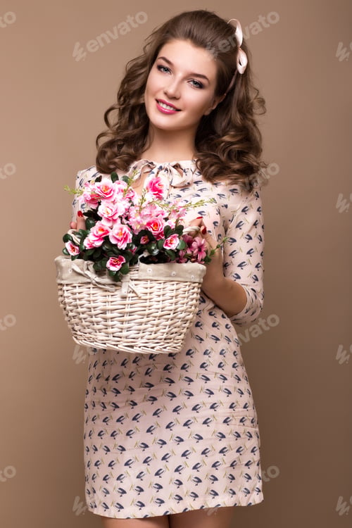 Preview: Stylish Woman Holding Flower Basket in Studio Setting