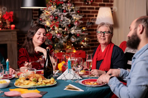 Preview: Woman and man celebrating christmas with parents