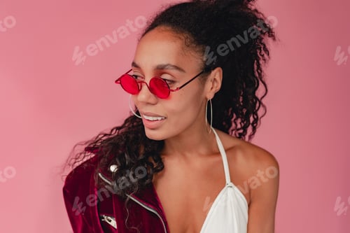 Preview: attractive black african american woman in stylish outfit on pink background