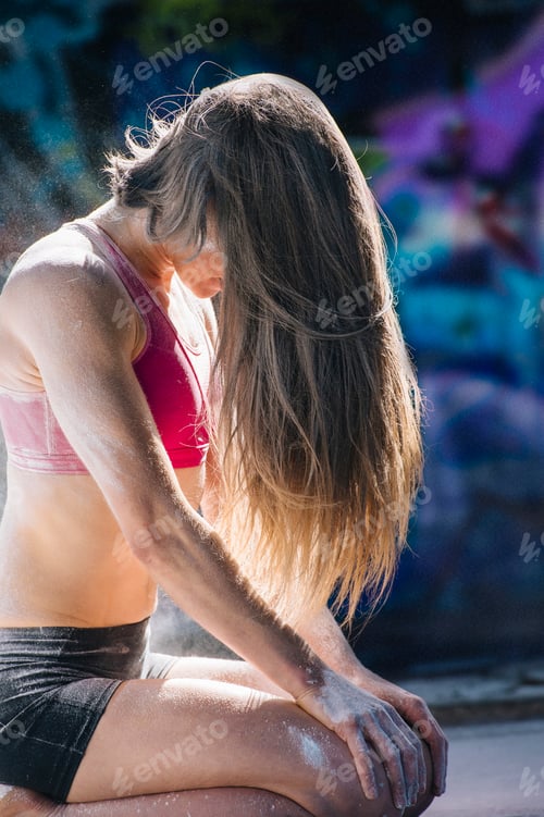Preview: Woman kneeling, hair covering face