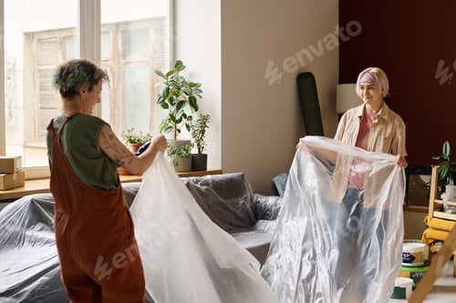 Preview: Women covering furniture to make repair
