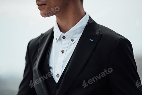 Preview: Portrait of authentic candid brunette man in business black suit