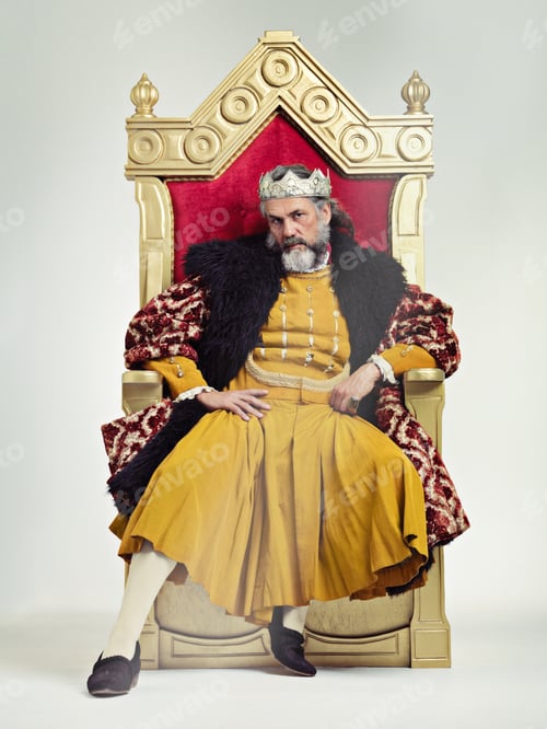 Preview: Being king isnt all fun and feasts. Studio shot of a richly garbed king sitting on a throne.