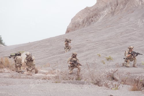 Preview: Soldiers in camouflage military uniforms carrying weapons Reconnaissance missions in rugged mountain