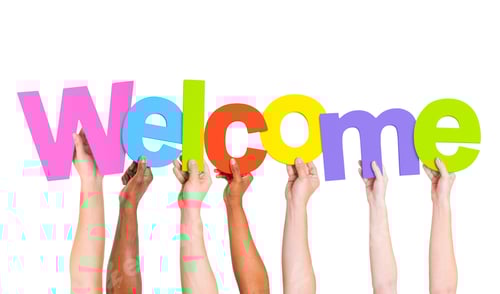 Preview: Multi-Ethnic Group Of People Holding The Word Welcome