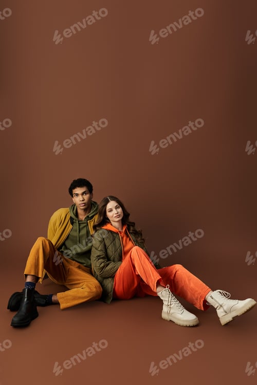 Preview: Stylish young couple showcases autumn fashion trends in vibrant outfits