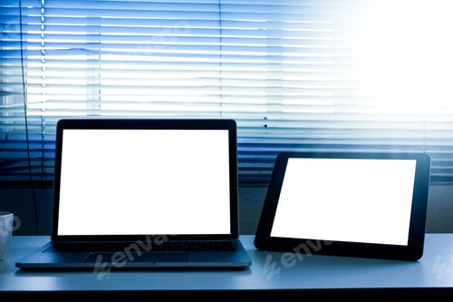 Preview: Blank screen laptop and tablet computer on the table