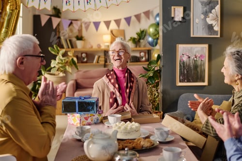 Preview: Senior Woman Expressing Gratitude While Friends Applauding at Party