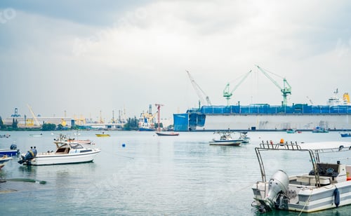 Preview: Large ship docked peacefully at busy port. Vital role of maritime logistics and transport.