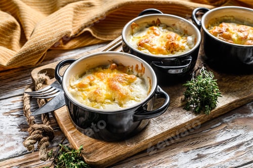 Preview: Chicken and mushroom casserole in a clay pot. White background. Top view