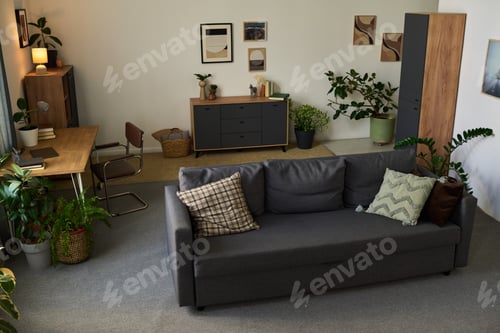 Preview: Modern Living Room Interior Featuring Sofa and Desk in Cozy Home Setting