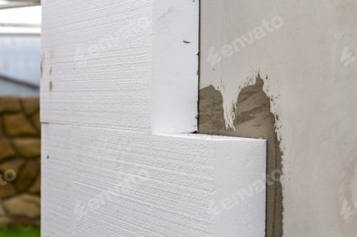 Preview: Close-up detail of plastered house wall with rigid styrofoam insulation. Modern technology