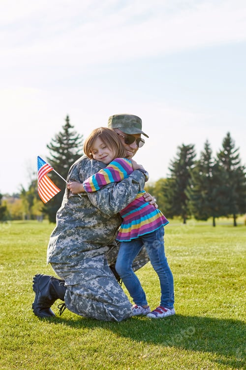 Preview: Little kid with usa flag is embracing her father.