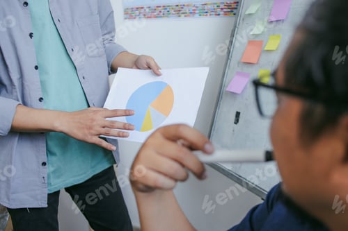 Preview: Collage Student Hands Presenting Pie Chart To Teacher Focusing On Financial Statistics