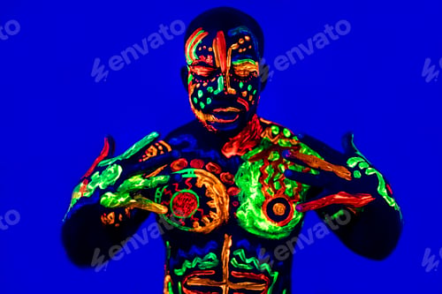 Preview: afro american man posing in studio shot with UV light