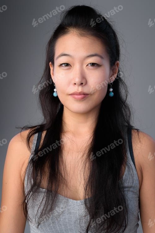 Preview: Face of beautiful Asian woman looking at camera