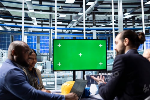 Preview: Photovoltaics factory team monitoring system performance using mockup monitor