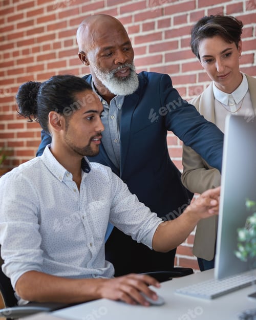 Preview: Business people using computer in office african american team leader man pointing at screen sharin