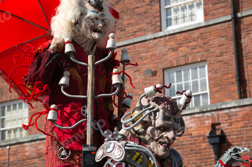 Preview: People dressed in medieval attire enjoying a sunny day at a festive event