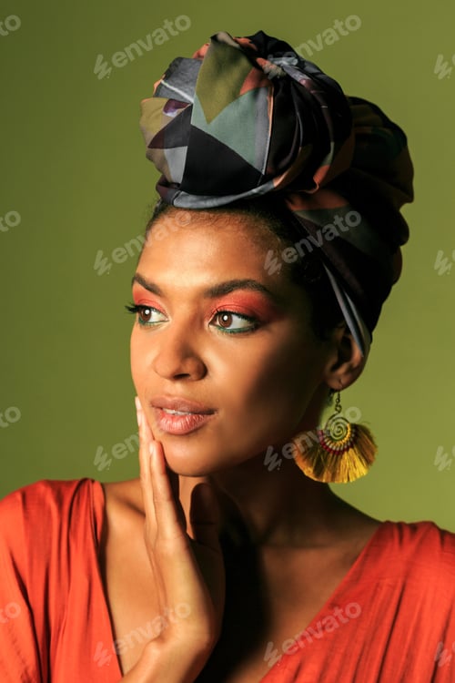 Preview: Beauty portrait ofStylish woman with colorful turban in studio.