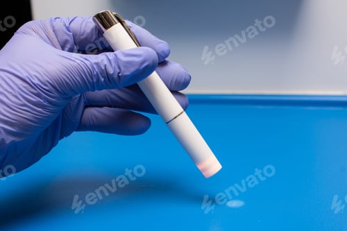 Preview: Closeup shot of a doctor holding a medical instrument - medical concept