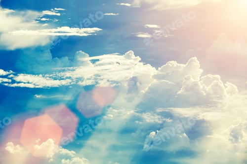 Preview: Sky and clouds with sunlight and flare.