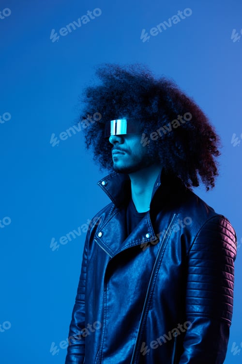 Preview: Portrait of fashion man with curly hair with stylish glasses on blue background multinational