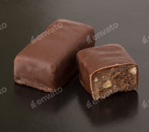 Preview: Sweet chocolate candy isolated on black background