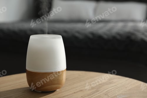 Preview: Modern aroma lamp on wooden table indoors. Space for text