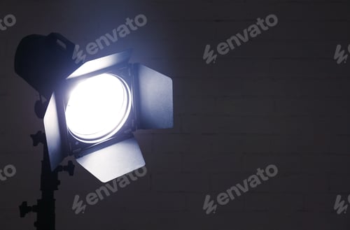 Preview: Professional photo studio lighting equipment near brick wall. Space for text