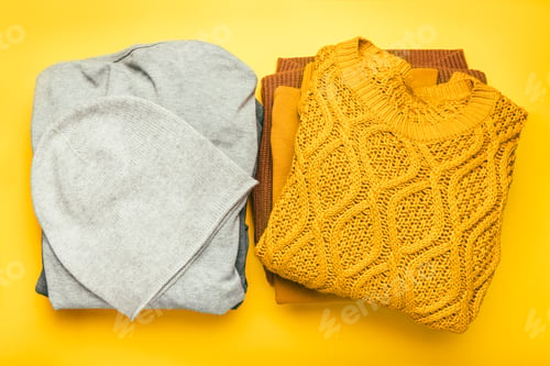 Preview: Folded Knitwear on a Cheerful Yellow Background