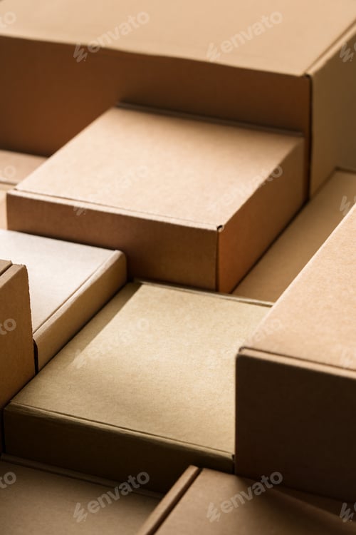 Preview: Stacked cardboard boxes arranged in a neat pattern under natural light