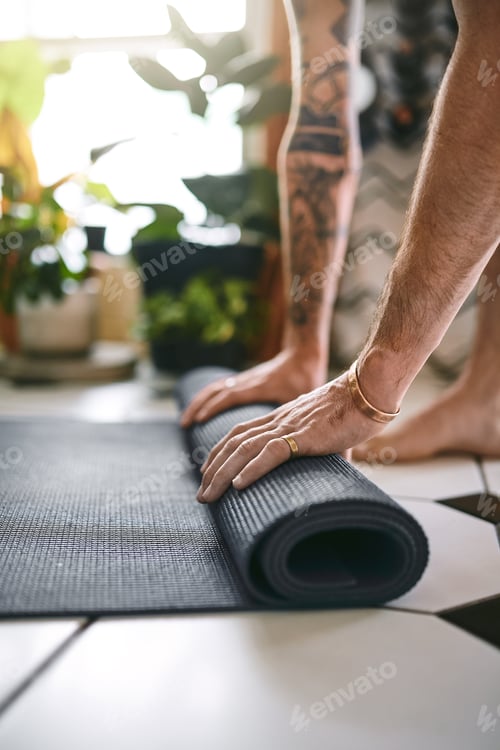Preview: Adult Rolling Up Yoga Mat Inside House