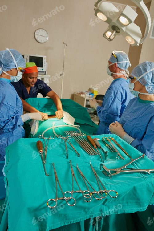 Preview: Shot of a team of surgeons performing a surgery in an operating room