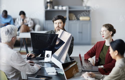Preview: Team of Business People Working in Office