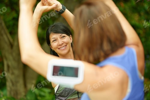 Preview: Two Mature Women Keeping Fit And Streching Before Jogging