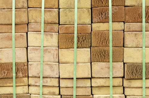 Preview: Geometric Arrival Of Spring: Stacks Of Beige Bricks Delivered For Landscaping In Botanical Garden