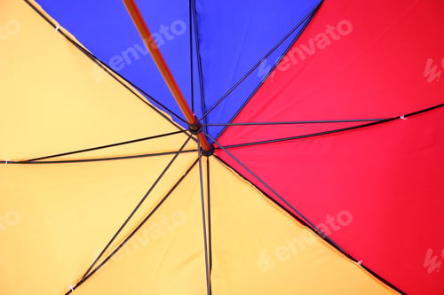 Preview: Umbrella From Underneath In Blue, Red And Yellow